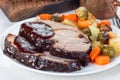 Pork shoulder in honey parmesan and soy souse, prepared in slow cooker or crockpot, served with carrot, potato and brussel cabbage Royalty Free Stock Photo