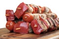 Pork Skewered Kebab In Stack On Wood Board White Isolated