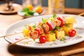 pork skewers with pineapple and cherry tomatoes on a plate Royalty Free Stock Photo