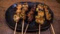 Pork skewers then grilled. Yakitori are a Japanese food in izakaya bar