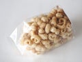 Pork snack, rind, scratching or crackling food packed in a clear plastic bag Royalty Free Stock Photo