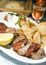 Pork souvlaki with tzatiki house wine bread Royalty Free Stock Photo