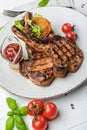 Pork steak with bone and potato pancakes Royalty Free Stock Photo