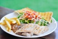 pork steak and chicken steak with French fries ,bread and salad or grilled pork and grilled chicken with fried potato Royalty Free Stock Photo