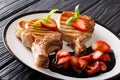 Pork steak fried on a grill and balsamic strawberry sauce close-up on a plate. horizontal Royalty Free Stock Photo