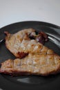 Pork steak grilled with salad and tomato Shallow depth of field Royalty Free Stock Photo