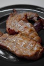 Pork steak grilled with salad and tomato Shallow depth of field Royalty Free Stock Photo