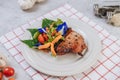 Pork Steak with Tomato, Carrot, Red Onion, Peppermint, Butterfly Pea Flower, and Lime Royalty Free Stock Photo