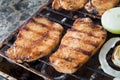 Pork steaks on grill Royalty Free Stock Photo