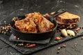 Pork stew in frying pan on black background, close up view Royalty Free Stock Photo