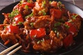 Pork in sweet and sour sauce with peppers, carrots and onions ma Royalty Free Stock Photo