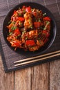 Pork in sweet and sour sauce with peppers, carrots and onions. V Royalty Free Stock Photo