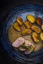 pork tenderloin with baked potatoes and French coarse mustard sauce Royalty Free Stock Photo