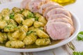 Pork tenderloin with herbs and spices, pesto gnocchi