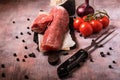 Pork tenderloin and other ingredients on vintage board Royalty Free Stock Photo