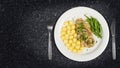 Pork tenderloin with potatoes and wild mushroom sauce and green beans on white plate Royalty Free Stock Photo