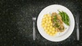 Pork tenderloin with potatoes and wild mushroom sauce and green beans on white plate Royalty Free Stock Photo