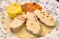 Pork tenderloin with vegetable garnish and potato dice in pepper sauce Royalty Free Stock Photo