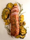 Pork tenderloin bacon wrapped sliced with vegetables Royalty Free Stock Photo