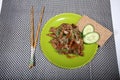 Pork in teriyaki sauce with slices of cucumber with cucumber slices and bread Royalty Free Stock Photo
