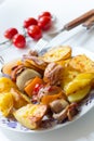Porky skewer with potato wedges Royalty Free Stock Photo