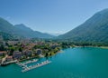 Porlezza town, Lugano Lake. Aerial photo of town surrounded by mountains