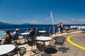 Poros, Cephalonia island, Greece - July, 17 2019: Passengers of the cruise ship relaxing at open deck aft and looking at