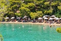 Poros, Greece 28 June 2023. Love bay beach with local people and tourists enjoying summer vacations.