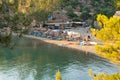 Poros, Greece 28 June 2023. Russian bay beach with local people and tourists enjoying summer vacations.