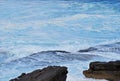 Porous rock and lots of sea foam in azure water at Bondi Beach