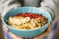 Porridge bowl in woman hands Royalty Free Stock Photo