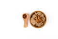 Porridge, Cinnamon and Almonds and in the Spoon on top in a wooden bowl and wooden spoon isolated on white background Royalty Free Stock Photo