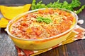 Porridge corn with meat and vegetables in roaster on board Royalty Free Stock Photo