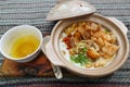 porridge served on hot claypot topped with chicken, sweet corn, skipjack tuna, tofu, green onions, crackers, dumplings and broth.