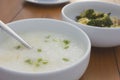 Porridge and stir fried vegetable in white bowl Royalty Free Stock Photo