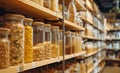 Porridges, cereals, kinds of pasta are stored in glass jars carefully placed on Eco-friendly store shelves. Successful business, Royalty Free Stock Photo