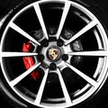 Porsche alloy wheel and emblem Royalty Free Stock Photo