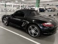 Porsche Boxter luxury sports car brown color in parking lot
