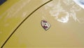 Porsche Budge on 911 Turbo Car Hood, Logo with Horse, Yellow Car, Vertical Video