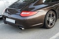 Porsche Carerra luxury sports car brown color in parking lot