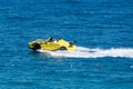 Porsche Carrera GTS yellow car speedboat rush through the waters of the mediterranean sea. Turkey, Antalya 02 may 2023