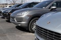 Porsche Cayenne and Macan SUV display at a dealership. Porsche offers a full line of sports cars and sports SUV Royalty Free Stock Photo