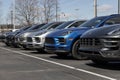 Porsche Cayenne and Macan SUV display at a dealership. Porsche offers a full line of sports cars and sports SUV Royalty Free Stock Photo