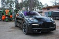 Kiev, Ukraine - 11 April; Porsche Cayenne Turbo TechArt Magnum on background kombine Royalty Free Stock Photo