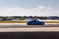 Porsche Cayman car driving around a winding track