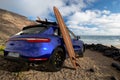 Porsche Macan on the ocean beach Royalty Free Stock Photo