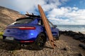 Porsche Macan on the ocean beach