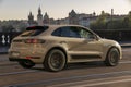Porsche Macan on the road leading over the Prague Bridge Royalty Free Stock Photo