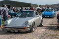 2 Porsche 911s, one silver and one blue