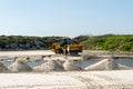 PORT ARANSAS, TX - 20200213: Caterpillar front end loader leveling sand